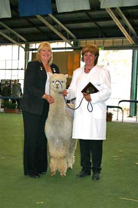 Dianne Judging Royal Melbourne standing with Supreme Champion