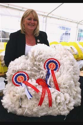 Dianne Judging Champion fleece at Royal England